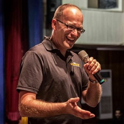 Nick Orton speaking on stage